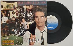 Huey Lewis a signé l'album Sports avec un certificat d'authenticité, preuve exacte d'un disque vinyle autographié.