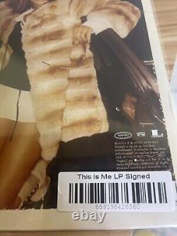 Jennifer Lopez C'est moi. Ensuite, disque vinyle noir signé JLO dédicacé.