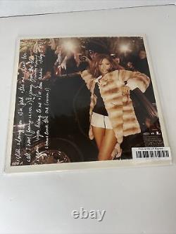 Jennifer Lopez C'est moi. Ensuite, vinyle noir signé LP JLO autographié en main.