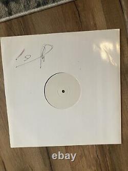 Vinyle Split LP de Foals dédicacé signé par Yannis avec le logo de l'œil dessiné à la main